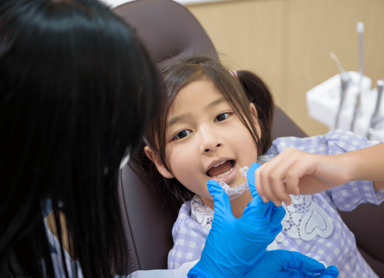 Child getting retainer fitted