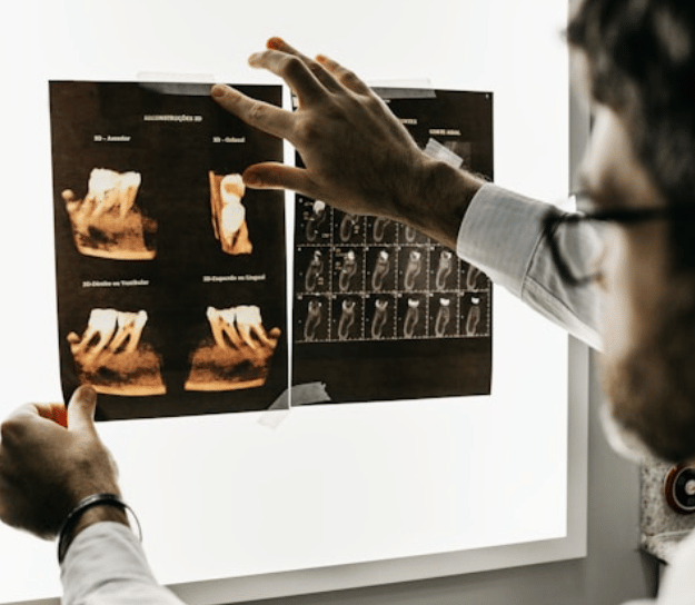 Dentist examining x-rays