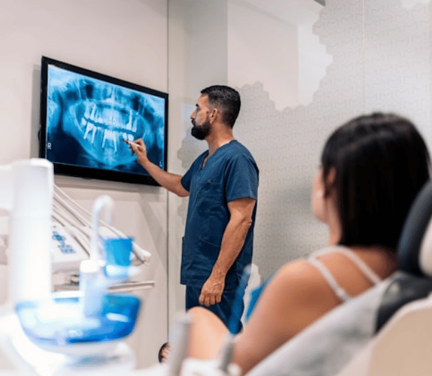 Dentist explaining to patient