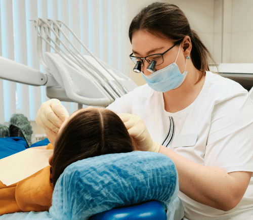 Dentist performing crown procedure to patient