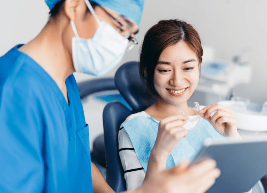 Dentist showing preventative appliance to patient