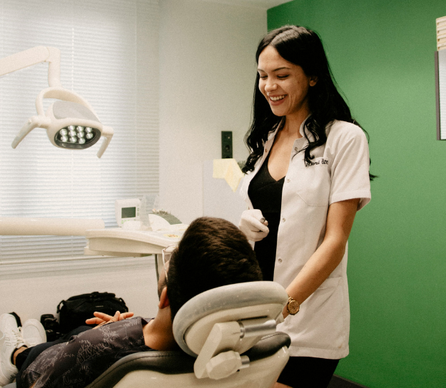 Dentist talking with patient