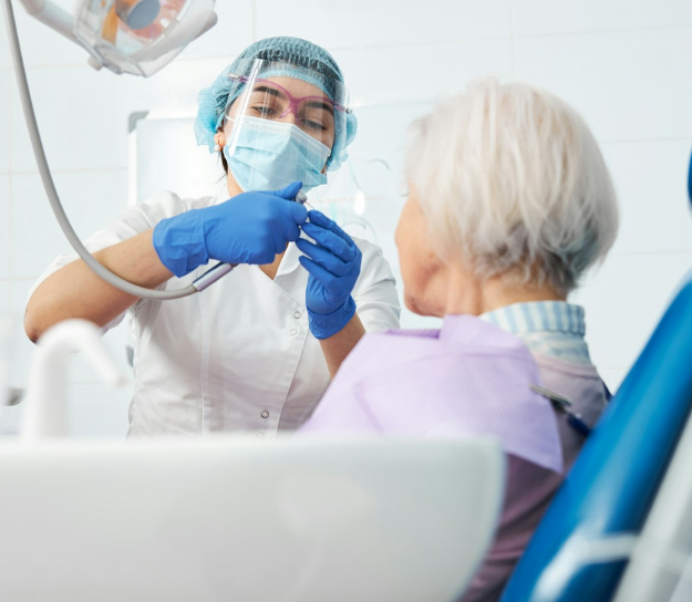 Dentist with patient performing inspection