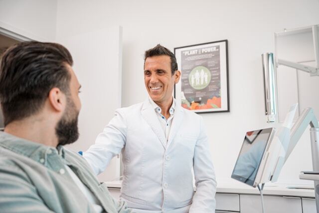 Happy dentist at office