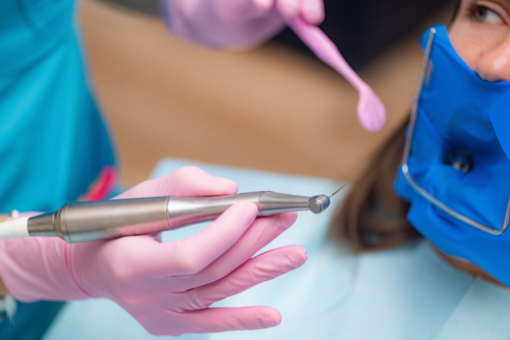 Root Canal Treatment. An Endodontist Preparing Patient for Root Canal Treatment.