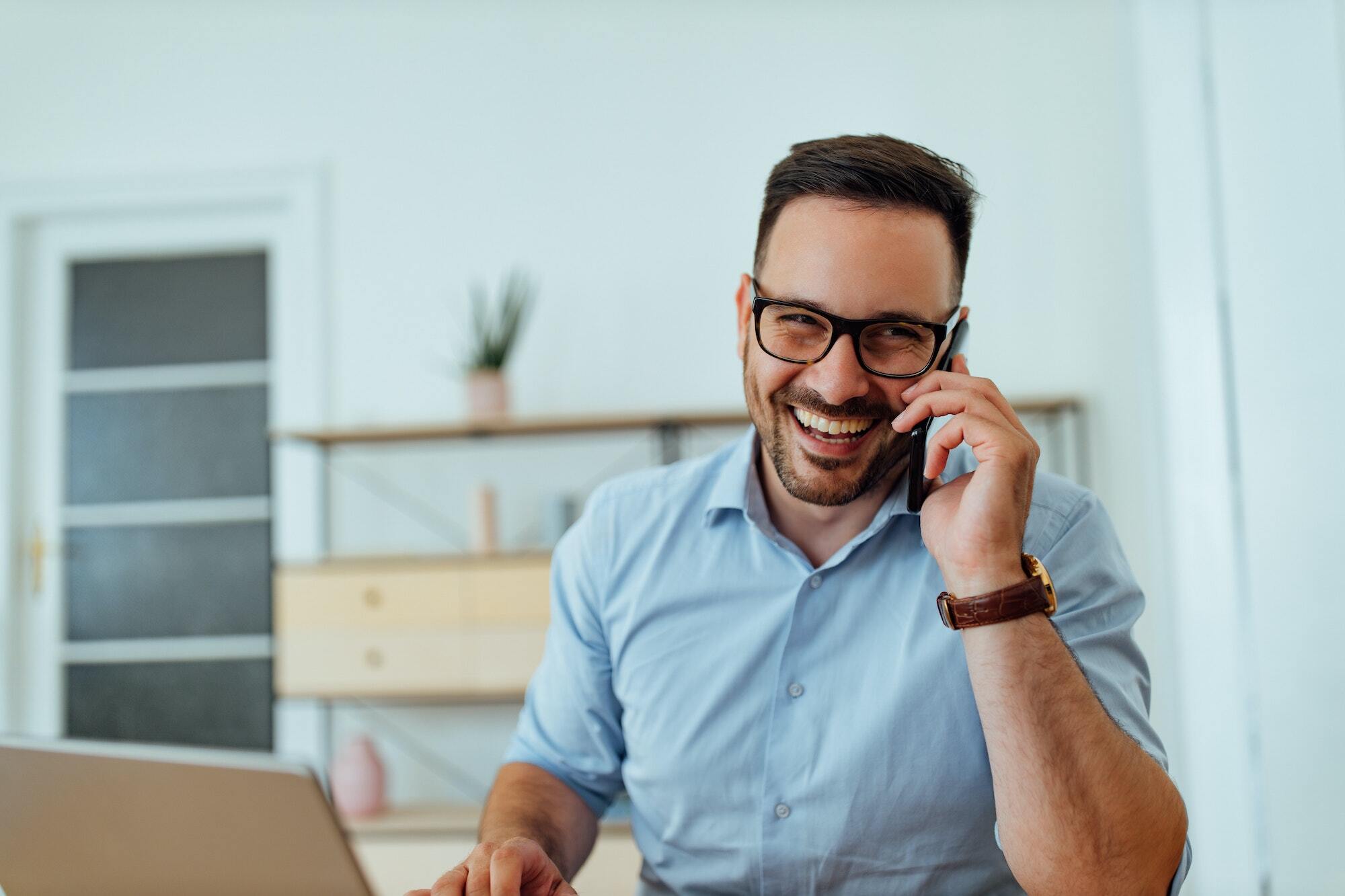 Wear glasses, smiling with teeth.