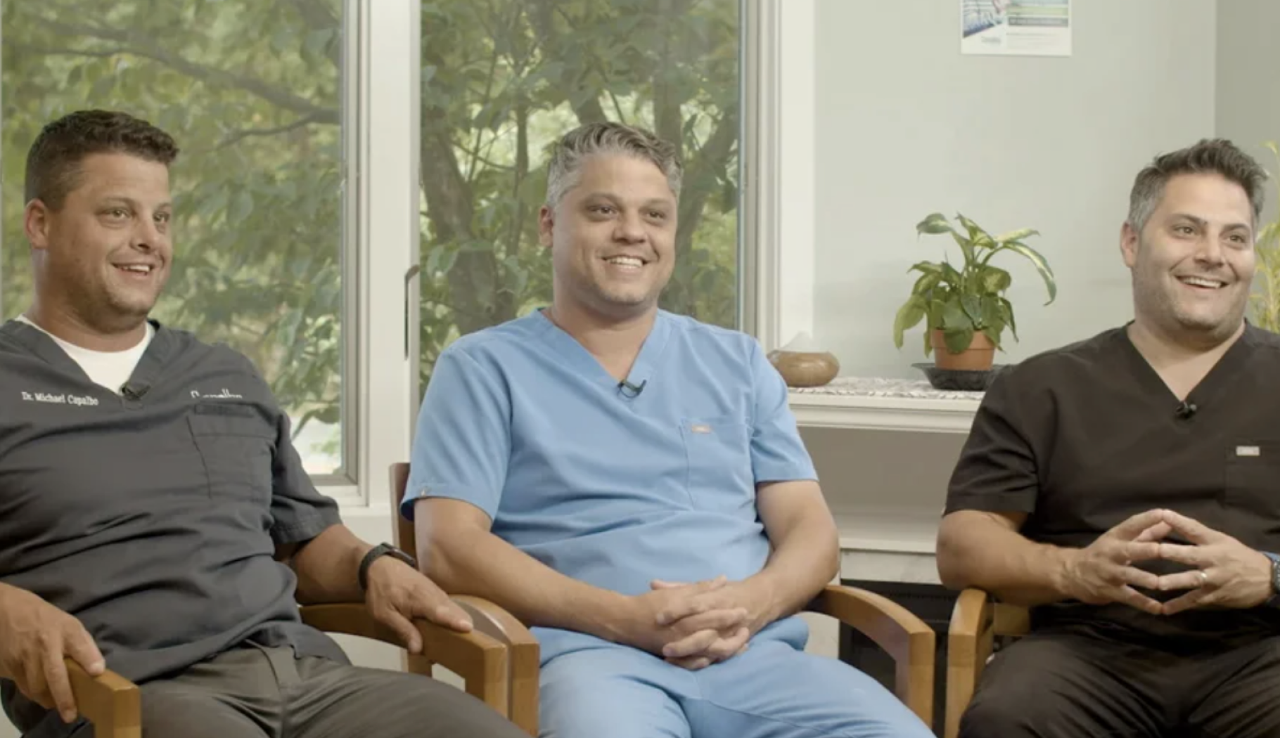 The Capalbo brothers dentists smiling together at Westerly Dental Clinic