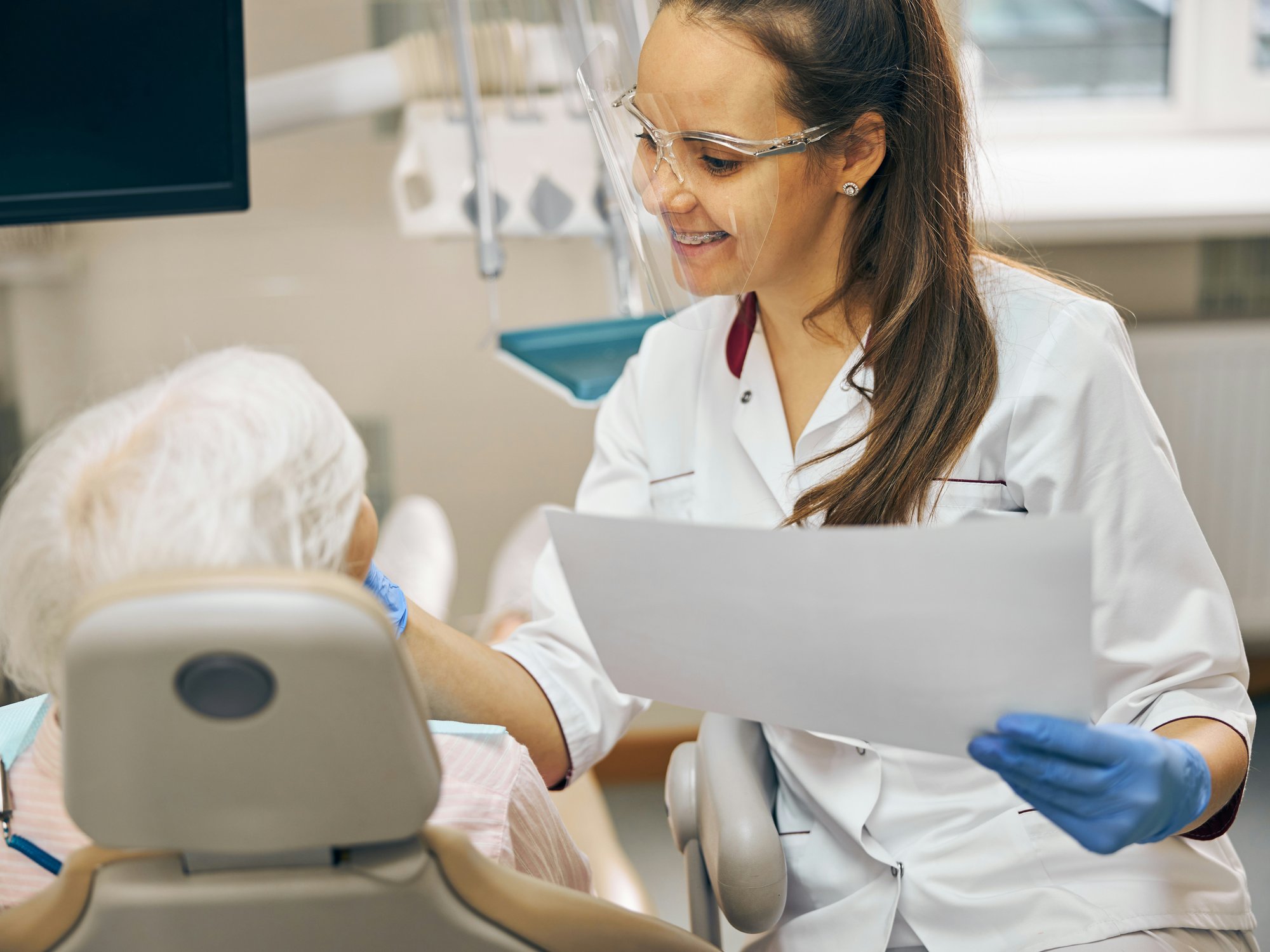 Dental practitioner explaining procedure 