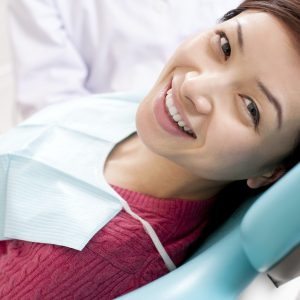 Patient receiving treatment in oral surgery dental practice