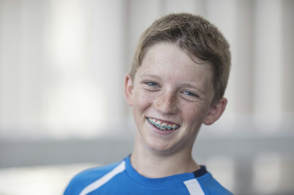 Portrait of smiling boy with braces – Orthodontist in Wakefield RI – Orthodontist in Westerly RI – Ocean State Orthodontics